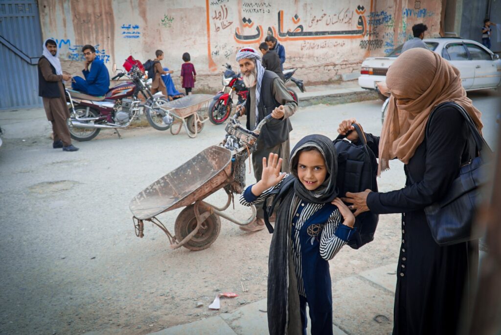 Afghans on their way to work and school